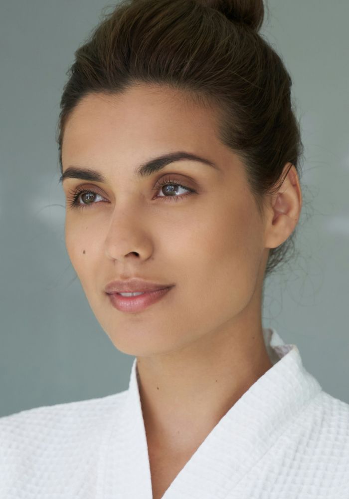 Woman with natural beauty in spa robe.