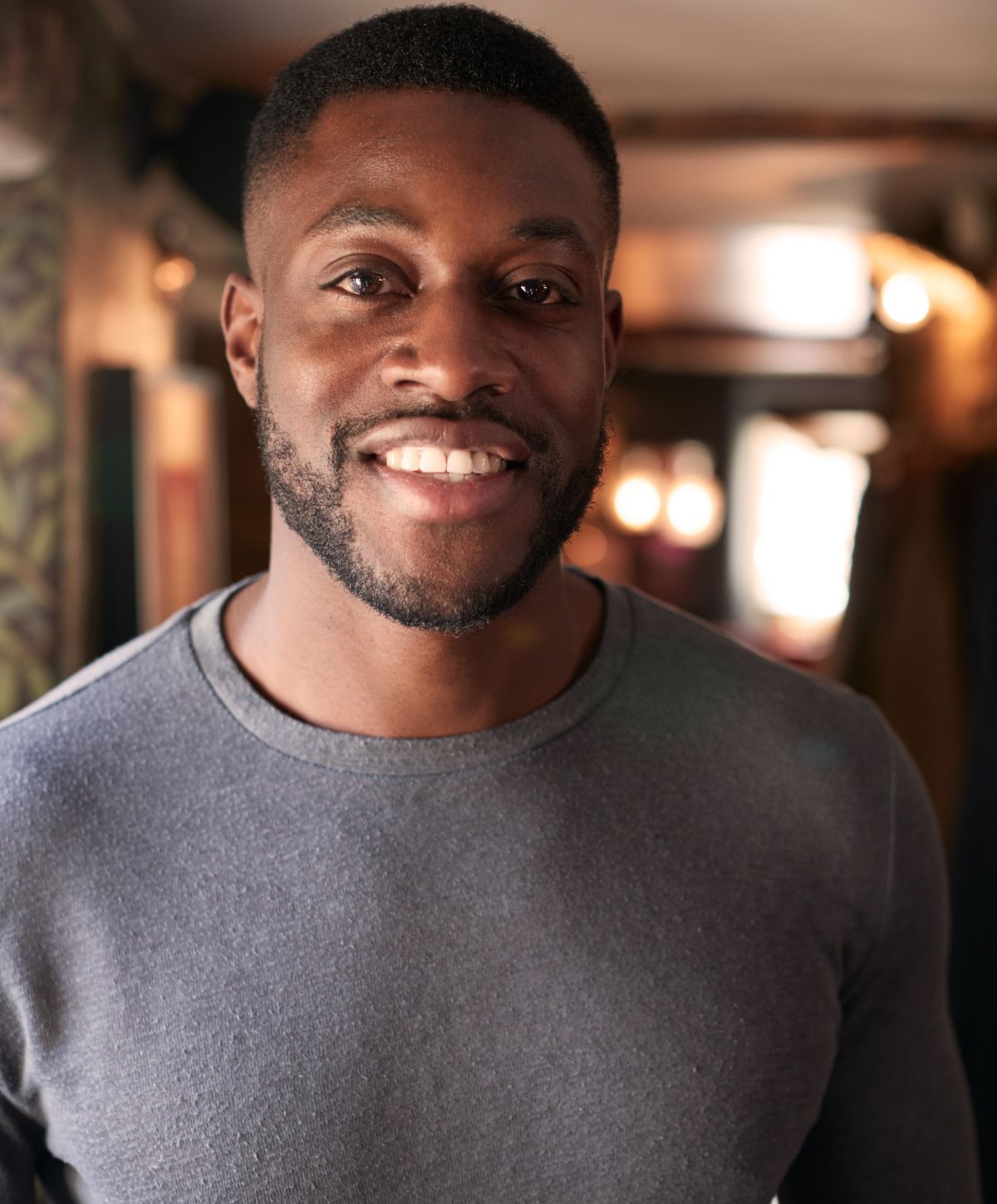 Franklin NeoGraft Hair Transplant Model with gray shirt