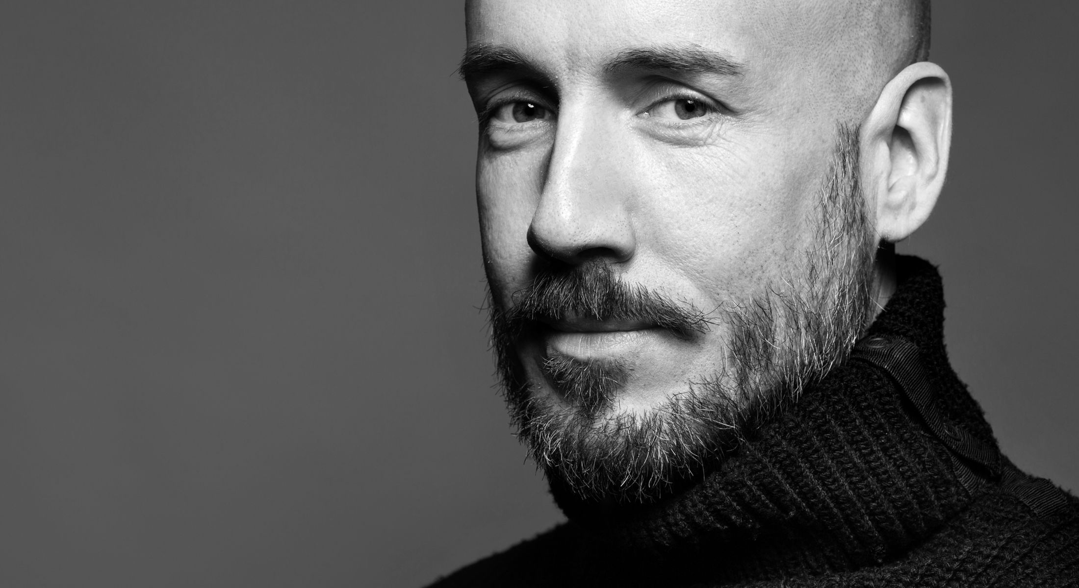 Botox for men model in black sweater